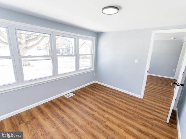 empty room featuring hardwood / wood-style flooring