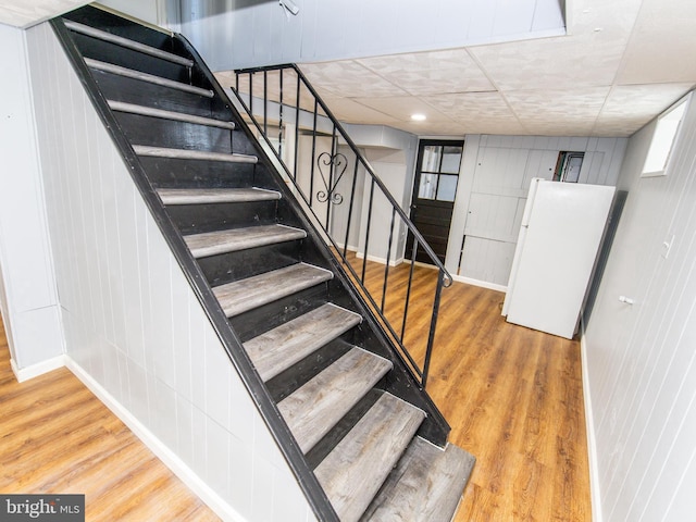 stairway featuring hardwood / wood-style floors