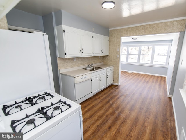 kitchen with white cabinetry, sink, white appliances, and decorative backsplash