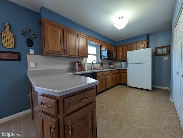 kitchen featuring black dishwasher, sink, white refrigerator, light tile patterned floors, and kitchen peninsula