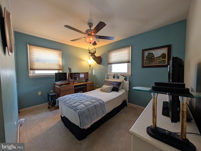 bedroom with light carpet and ceiling fan