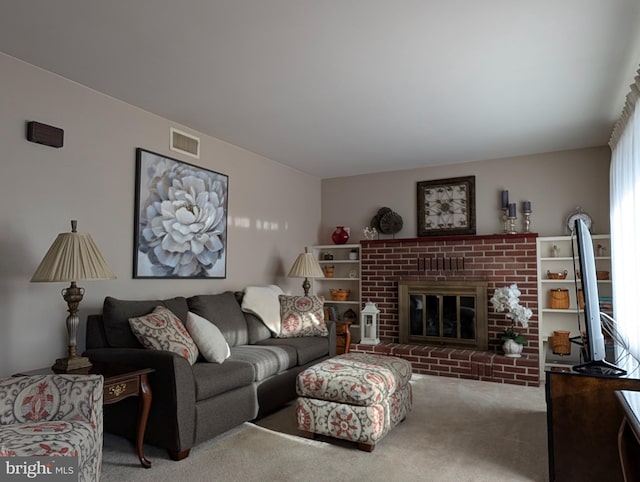 living room featuring a fireplace, plenty of natural light, and carpet flooring