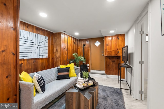 living room with wood walls