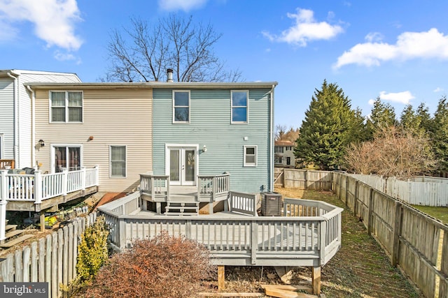 back of property featuring a wooden deck