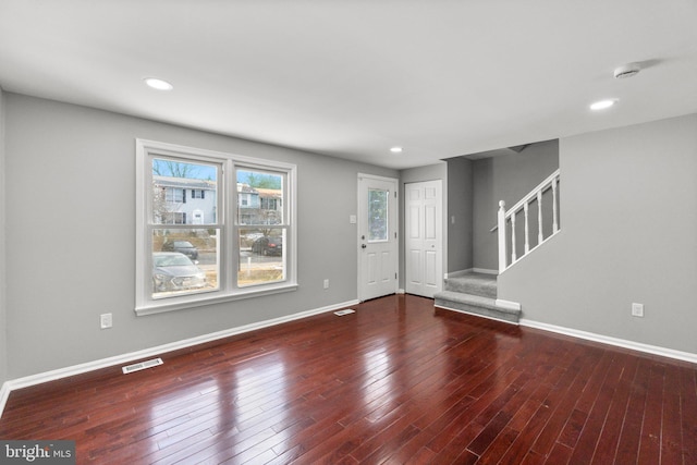 unfurnished living room featuring hardwood / wood-style floors