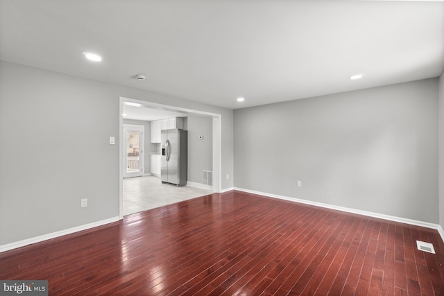 unfurnished room with light hardwood / wood-style flooring