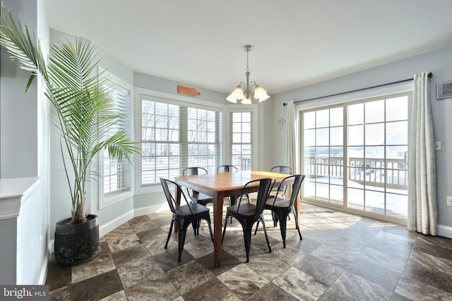 dining room with a chandelier