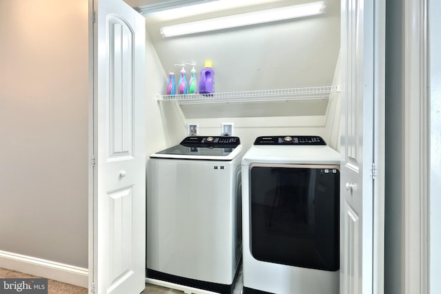 washroom featuring washer and clothes dryer