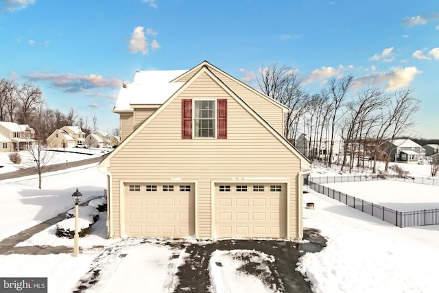 view of snow covered garage