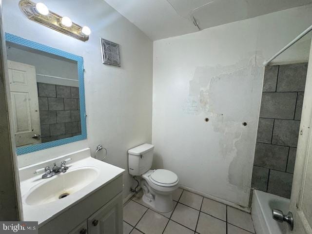 full bathroom with toilet, vanity, tile patterned floors, and tiled shower / bath