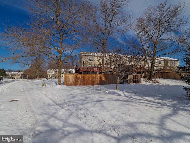 view of yard layered in snow