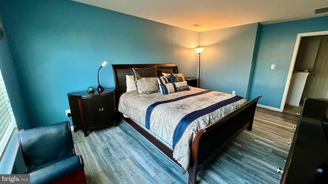 bedroom featuring hardwood / wood-style flooring