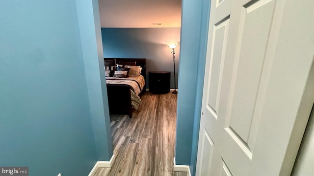 bedroom with wood-type flooring