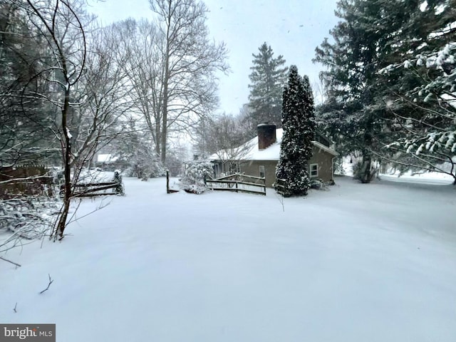 view of yard covered in snow