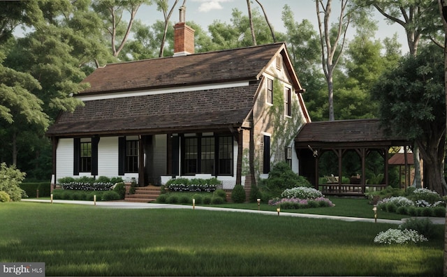 view of front of house with a gazebo and a front lawn