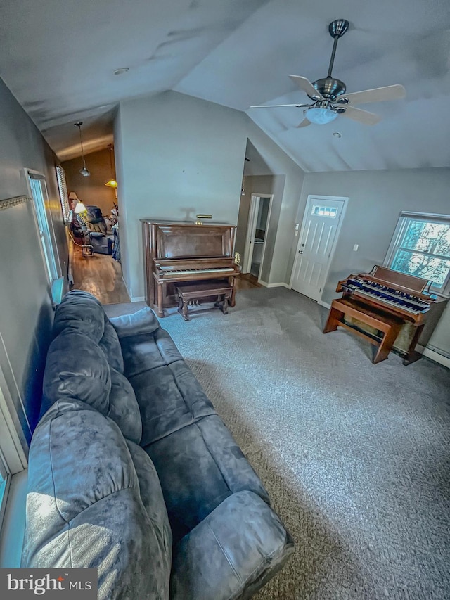 carpeted living room with lofted ceiling and ceiling fan