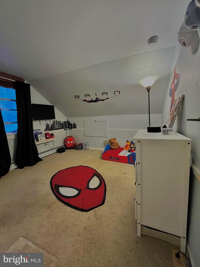 game room featuring vaulted ceiling, a baseboard radiator, and carpet