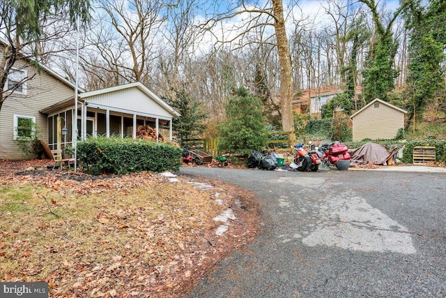 view of yard featuring a sunroom