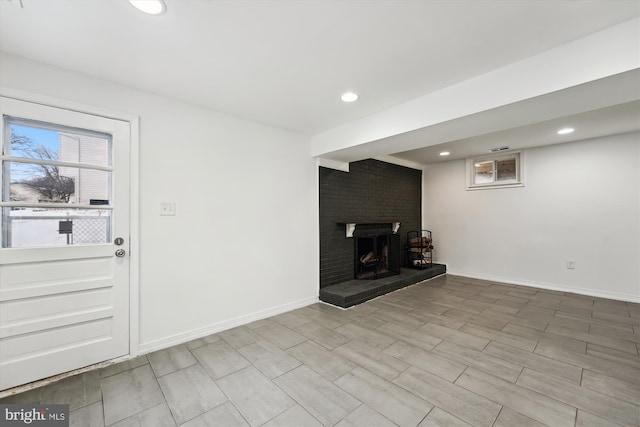 unfurnished living room featuring a fireplace