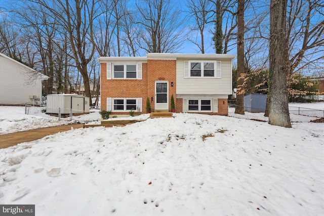 bi-level home featuring a storage shed