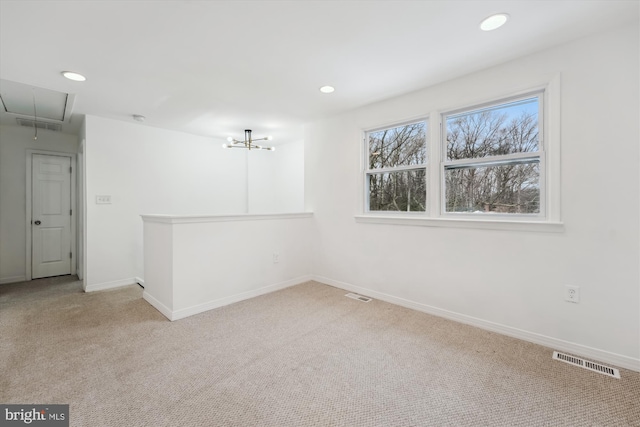 empty room with light colored carpet