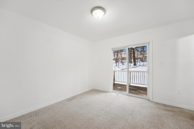 empty room with carpet flooring