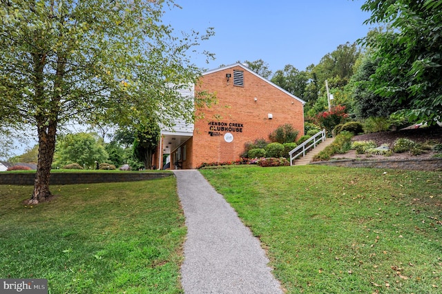 view of property exterior with a lawn