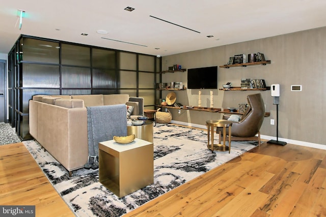 living room featuring baseboards and wood finished floors