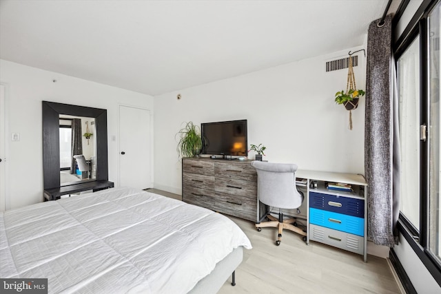 bedroom with light hardwood / wood-style floors