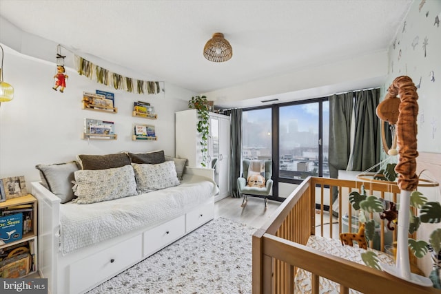 bedroom with hardwood / wood-style floors