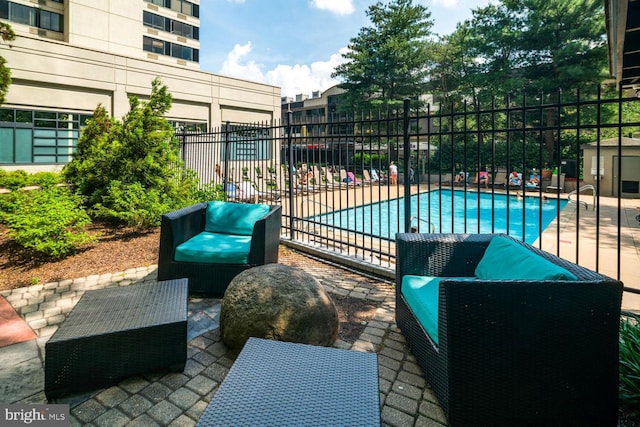 view of swimming pool with a patio area