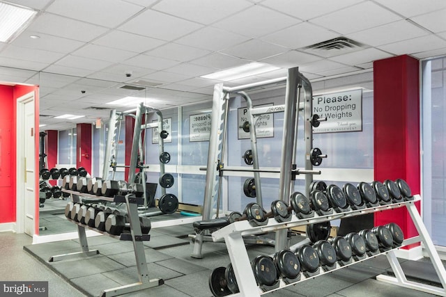 workout area with a drop ceiling