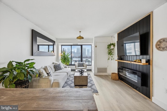 living room with light hardwood / wood-style floors