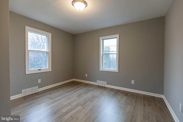 unfurnished room featuring light wood-type flooring