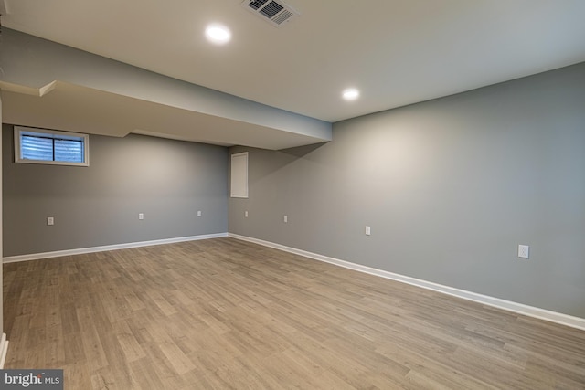 basement featuring light wood-type flooring