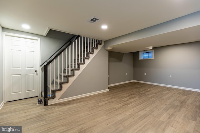 basement featuring hardwood / wood-style flooring