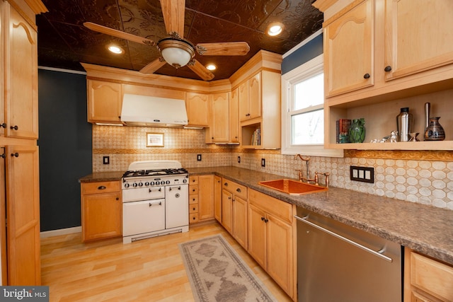 kitchen featuring dishwasher, range hood, double oven range, sink, and light brown cabinets