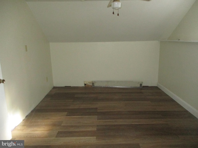 bonus room featuring lofted ceiling and dark wood-type flooring