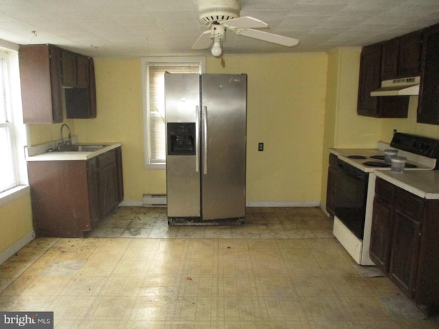 kitchen featuring light countertops, electric range oven, a sink, under cabinet range hood, and stainless steel fridge with ice dispenser