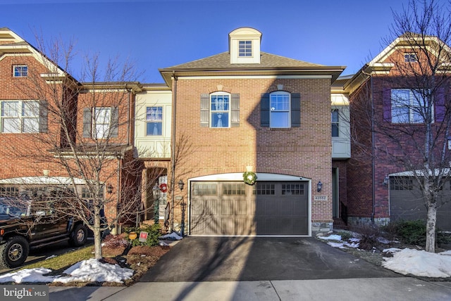 townhome / multi-family property featuring a garage