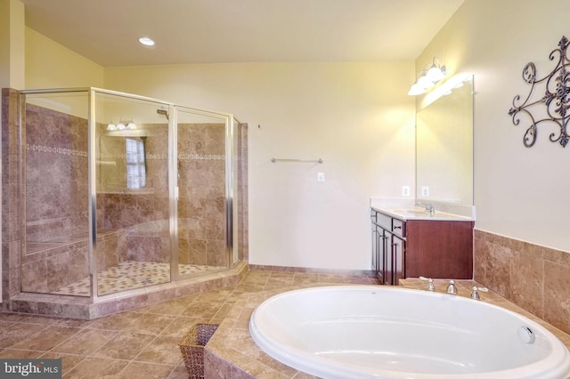 bathroom with separate shower and tub and vanity