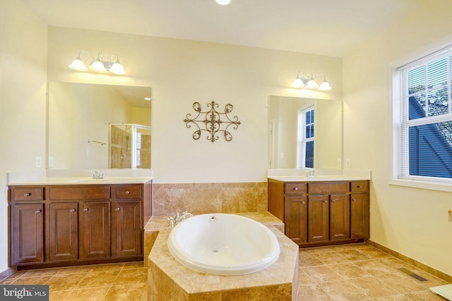 bathroom with plus walk in shower and vanity