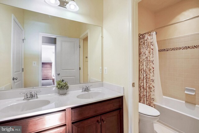 full bathroom featuring toilet, shower / tub combo, and vanity