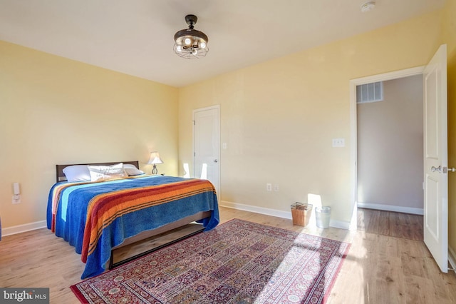 bedroom with light hardwood / wood-style floors