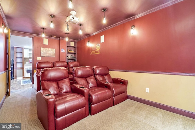 home theater room featuring carpet floors, built in shelves, and ornamental molding