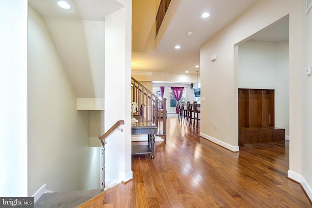 corridor featuring wood-type flooring