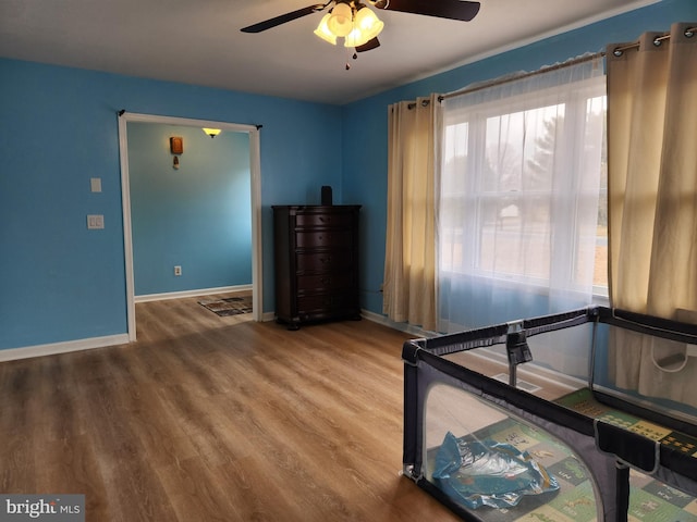 unfurnished bedroom with hardwood / wood-style flooring and ceiling fan