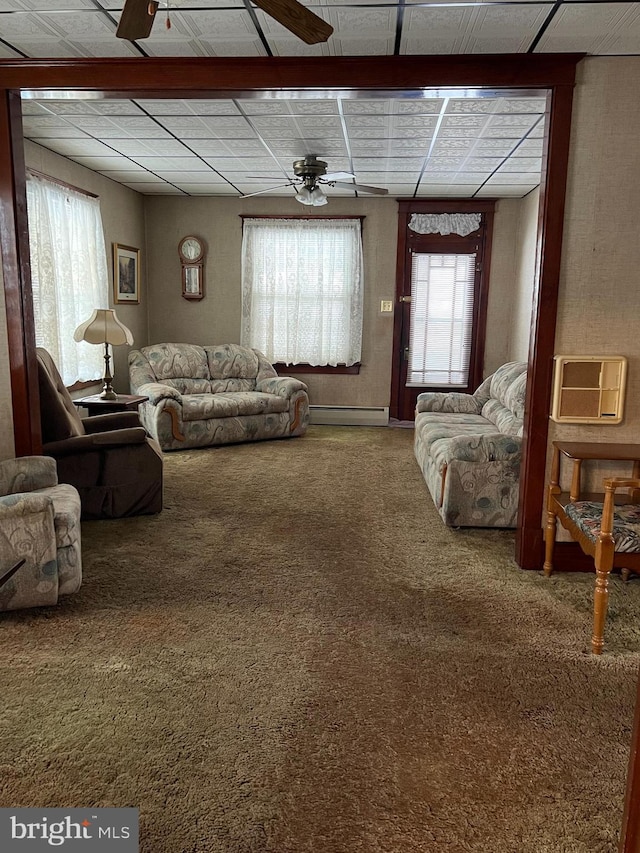 carpeted living room with baseboard heating