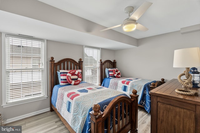 bedroom with ceiling fan and light hardwood / wood-style flooring