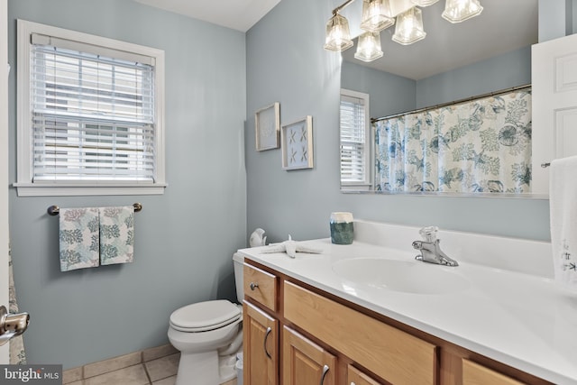 bathroom with tile patterned floors, vanity, and toilet